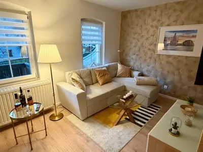 Ein Sitzbereich in der Unterkunft Ferienwohnung Kathy - Moderne, stilvolle Ferienwohnung mit Balkon, Sauna und kostenlosem Parkplatz im schönen Elbsandsteingebirge
