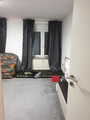 Ein Sitzbereich in der Unterkunft sharing room in apartment