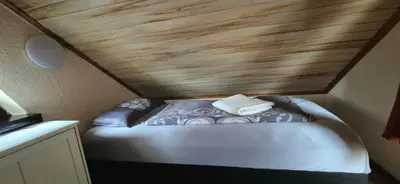 Ein Bett oder Betten in einem Zimmer der Unterkunft gemütliches Ferienhaus mit privatem Außenpool