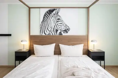 Ein Bett oder Betten in einem Zimmer der Unterkunft Aparthotel MY HOME Chemnitz-Limbach