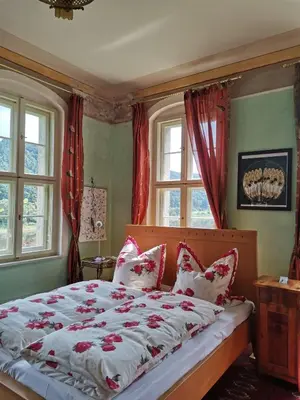 Ein Bett oder Betten in einem Zimmer der Unterkunft Herrenhaus Orangella