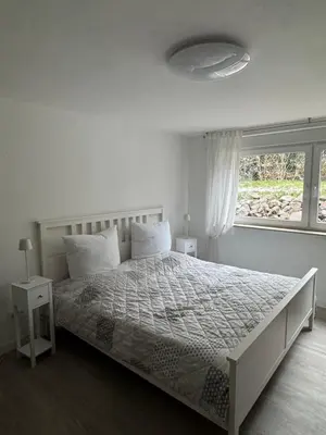 Ein Bett oder Betten in einem Zimmer der Unterkunft Ferienwohnung Anja