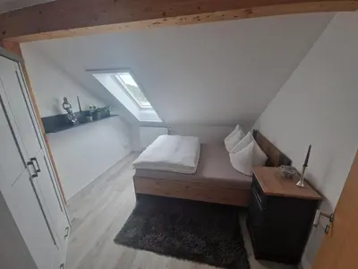 Ein Bett oder Betten in einem Zimmer der Unterkunft Moderne Ferienwohnung in Hainichen