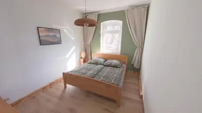 Ein Bett oder Betten in einem Zimmer der Unterkunft Ferienwohnung Stadtblick Königstein