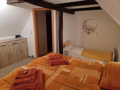 Ein Bett oder Betten in einem Zimmer der Unterkunft Ferienhaus - Ottendorf