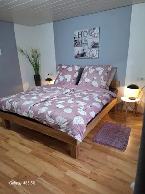 Ein Bett oder Betten in einem Zimmer der Unterkunft Ferienwohnung seeblick
