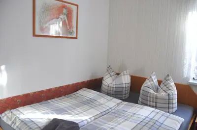Ein Bett oder Betten in einem Zimmer der Unterkunft Ferienwohnung Blaumeise