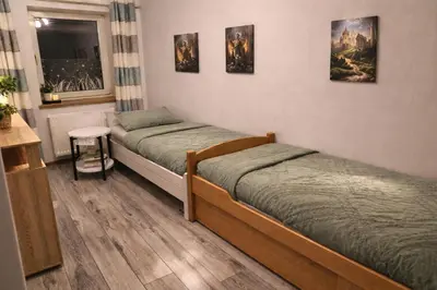 Ein Bett oder Betten in einem Zimmer der Unterkunft Ferienwohnung Saupe