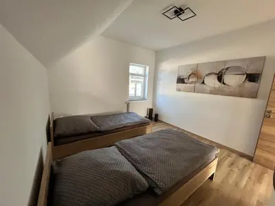 Ein Bett oder Betten in einem Zimmer der Unterkunft Ferienwohnung Zum Schlosspark Lauchhammer