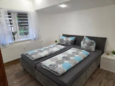 Ein Bett oder Betten in einem Zimmer der Unterkunft Ferienwohnung in Hilmersdorf