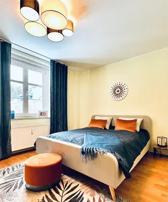 Ein Bett oder Betten in einem Zimmer der Unterkunft KÜCHWALDBLICK Designsuite