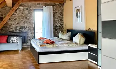 Ein Bett oder Betten in einem Zimmer der Unterkunft Alte Scheune Rietzschelhof mit Pool