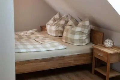 Ein Bett oder Betten in einem Zimmer der Unterkunft Haus Waldfrieden