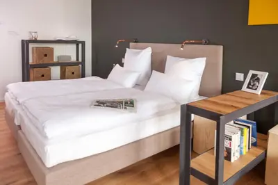 Ein Bett oder Betten in einem Zimmer der Unterkunft Staycity Aparthotels Dresden City Centre