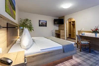 Ein Bett oder Betten in einem Zimmer der Unterkunft Hotel Zur Aussicht