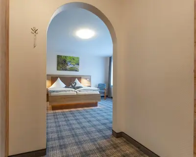 Ein Bett oder Betten in einem Zimmer der Unterkunft Hotel Zur Aussicht