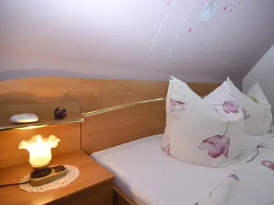 Ein Bett oder Betten in einem Zimmer der Unterkunft Gruppenausflug nach Sebnitz