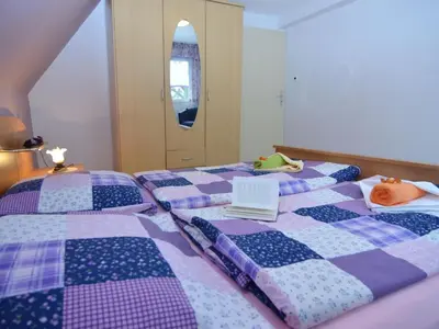 Ein Bett oder Betten in einem Zimmer der Unterkunft Gruppenausflug nach Sebnitz