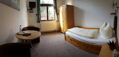 Ein Bett oder Betten in einem Zimmer der Unterkunft Gästehaus Stadtschaenke