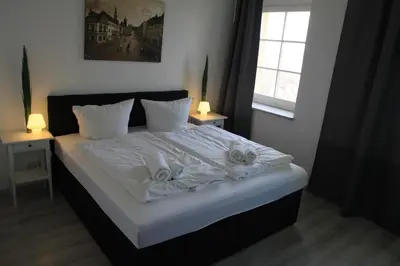 Ein Bett oder Betten in einem Zimmer der Unterkunft Schloß Sonnenstein