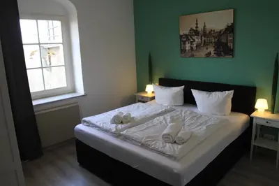 Ein Bett oder Betten in einem Zimmer der Unterkunft Schloß Sonnenstein