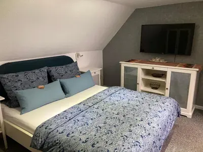 Ein Bett oder Betten in einem Zimmer der Unterkunft Ferienwohnung-Kubis