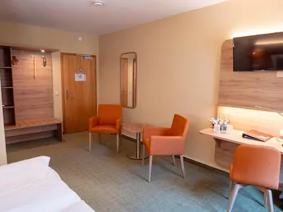 Ein Bett oder Betten in einem Zimmer der Unterkunft Altstadthotel 