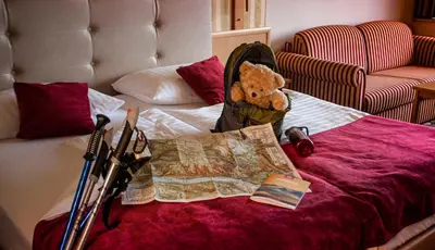 Ein Bett oder Betten in einem Zimmer der Unterkunft Berghotel Bastei