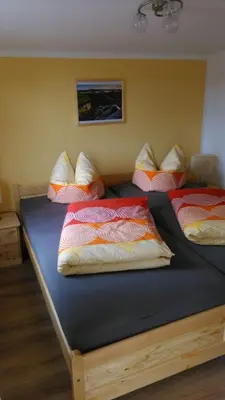 Ein Bett oder Betten in einem Zimmer der Unterkunft Ferienoase Lilienstein
