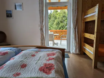 Ein Bett oder Betten in einem Zimmer der Unterkunft Ferienwohnungen Langer