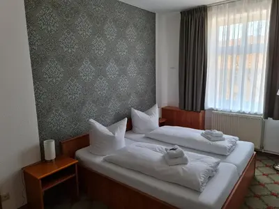 Ein Bett oder Betten in einem Zimmer der Unterkunft Parkhotel Senftenberg