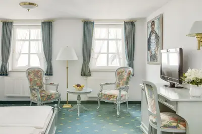 Ein Bett oder Betten in einem Zimmer der Unterkunft Hotel GARNI Residenz Am Markt Meißen