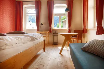 Ein Bett oder Betten in einem Zimmer der Unterkunft Bio-Hotel Zur Mühle