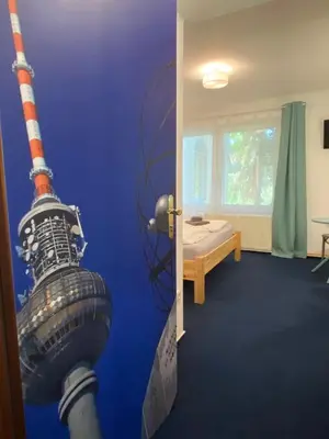 Ein Bett oder Betten in einem Zimmer der Unterkunft W.I.P. Welt im Park