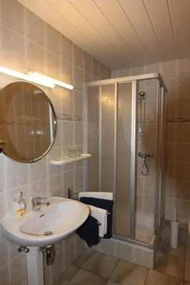 Ein Badezimmer in der Unterkunft W.I.P. Welt im Park
