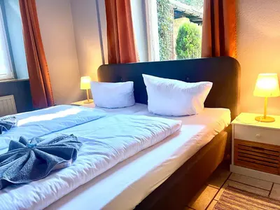 Ein Bett oder Betten in einem Zimmer der Unterkunft Sonnenhof Bad Schandau