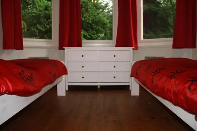 Ein Bett oder Betten in einem Zimmer der Unterkunft Ferienwohnung Jagdschloss Bielatal