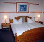 Ein Bett oder Betten in einem Zimmer der Unterkunft Hotel & Restaurant Kleinolbersdorf