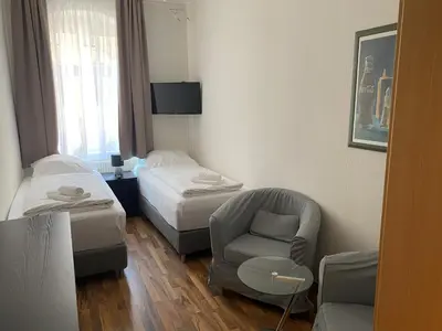 Ein Bett oder Betten in einem Zimmer der Unterkunft Pension an der Porzellan-Manufaktur