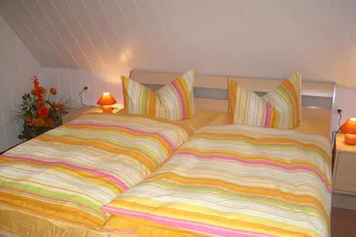 Ein Bett oder Betten in einem Zimmer der Unterkunft Ferienwohnung Ulbrich