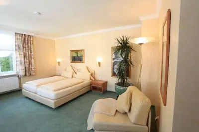 Ein Bett oder Betten in einem Zimmer der Unterkunft Pension am Großen Garten KG