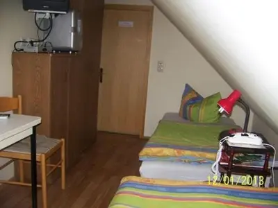 Ein Bett oder Betten in einem Zimmer der Unterkunft Pension Strohbach