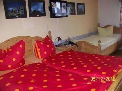 Ein Bett oder Betten in einem Zimmer der Unterkunft Pension Strohbach