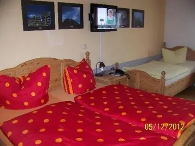 Ein Bett oder Betten in einem Zimmer der Unterkunft Pension Strohbach