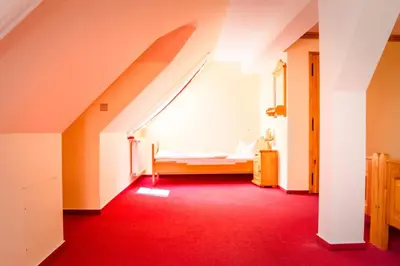 Ein Bett oder Betten in einem Zimmer der Unterkunft Hotel Schloßblick Trebsen