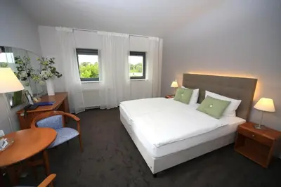 Ein Bett oder Betten in einem Zimmer der Unterkunft Hotel Moritz an der Elbe