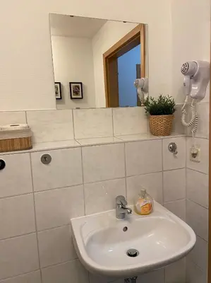 Ein Badezimmer in der Unterkunft Pension Garni No.11