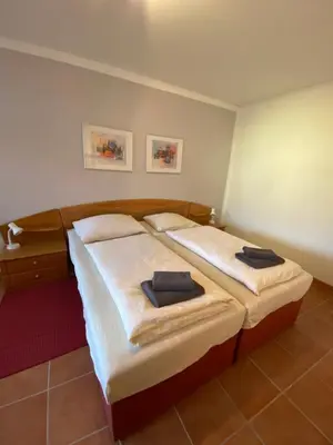 Ein Bett oder Betten in einem Zimmer der Unterkunft Pension Garni No.11
