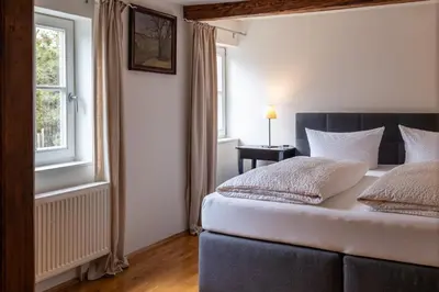 Ein Bett oder Betten in einem Zimmer der Unterkunft Apartmenthaus Brunnenhof