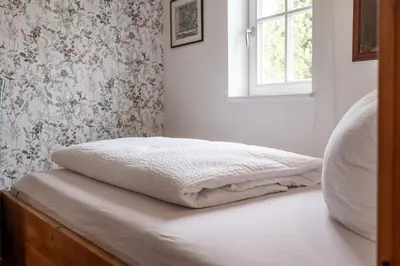 Ein Bett oder Betten in einem Zimmer der Unterkunft Apartmenthaus Brunnenhof
